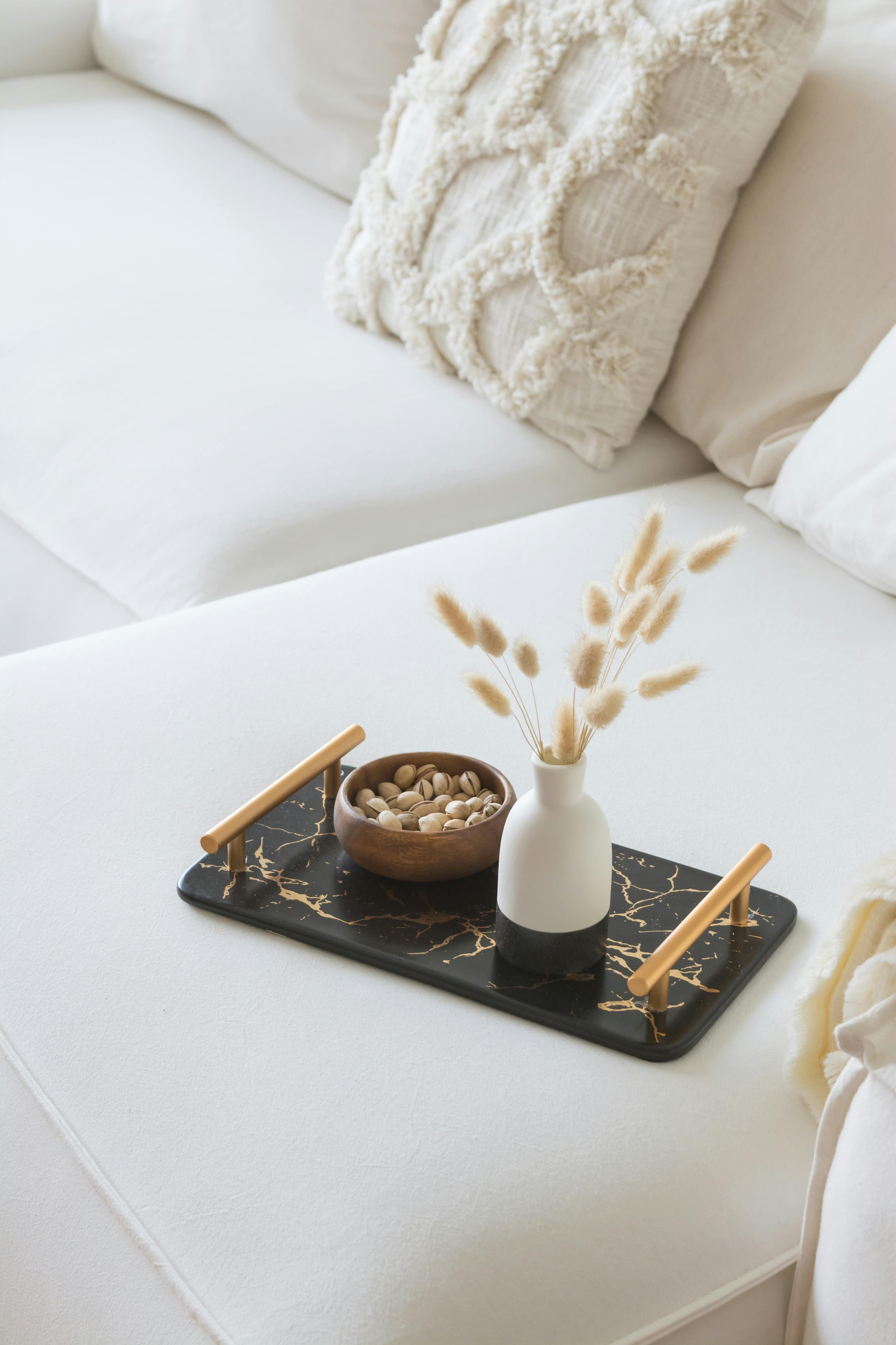 Marble tray styled on a sofa